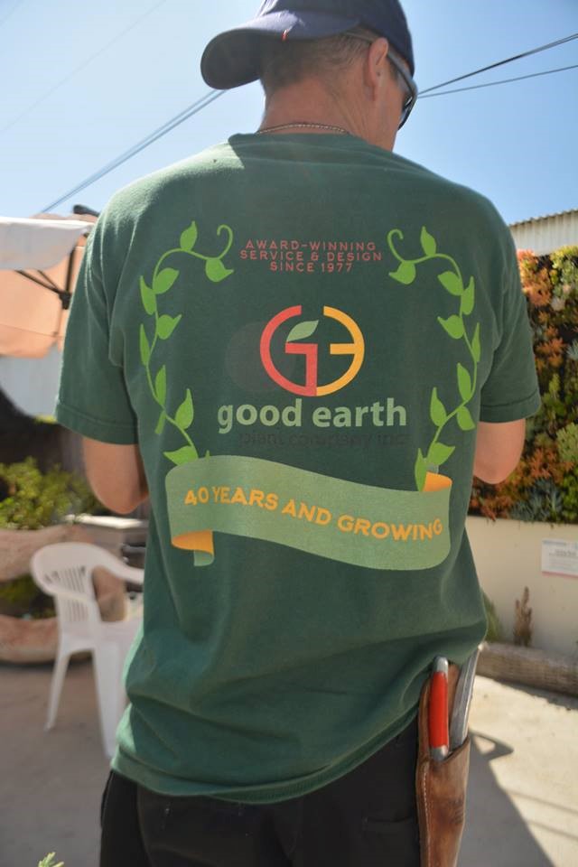 Good Earth employee with 40th anniversary logo on tshirt